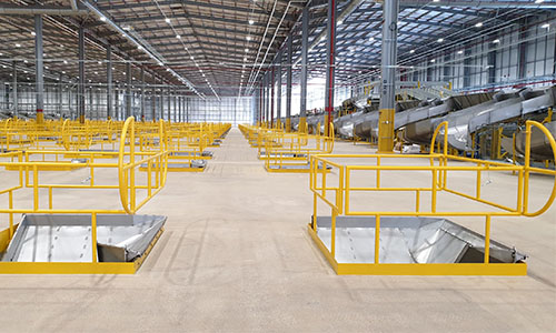 Mezzanine floor with several voids for product chutes