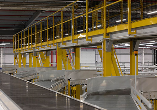 Mezzanine walkway and conveyor system