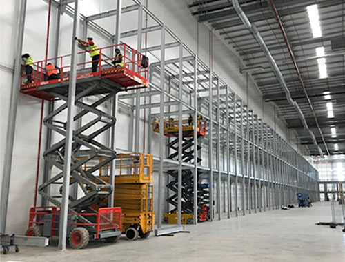 Working at height, installation of mezzanine floor in warehouse